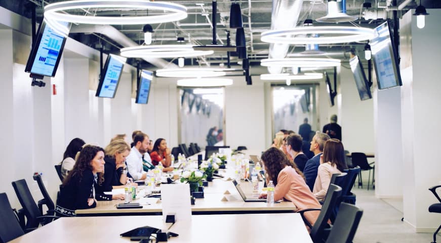 Executives seated around conference room table at Shore Capital Partners office